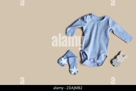 Composition with baby accessories on beige background. Unisex neutral theme. flat lay and top view. Copy space Stock Photo