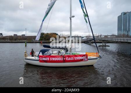 Glasgow, Scotland, UK. 13th November, 2020. Environmental campaigners protest on the banks of the River Clyde. Credit: Skully/Alamy Live News Stock Photo