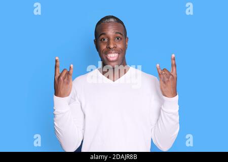 A handsome young african american man laughing gesturing Stock Photo