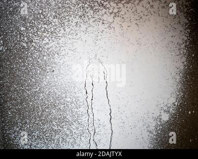 Dry white strokes and splash paint dripping on glass. Old grunge texture. Opaque stained window Stock Photo