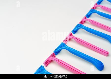 Pink and blue razors on white background Stock Photo