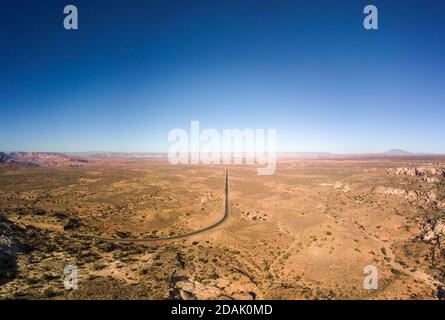 Panoramic drone view of a straight road towards the city of Page Arizona Stock Photo