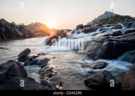 waterfall in the mountains at evening Stock Photo