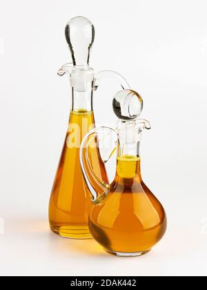 Glass decanter with olive oil on white background Stock Photo
