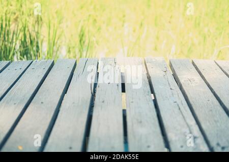 wooden table with rice paddy field background for montage display ...
