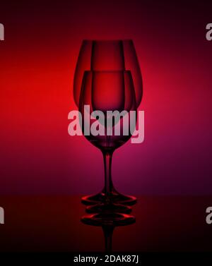 close-Up view Of various empty Glasses Against Colored Background Stock Photo