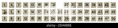 Very old numeric keypad, set of white plastic buttons, numbered from 1 to 50, isolated on white background Stock Photo