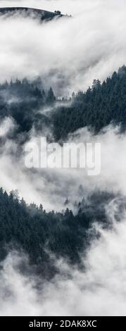 Ink and wash spiritual mountains landscape, traditional Japanese landscapes. Scenic foggy atmosphere above mountains by early morning. Stock Photo