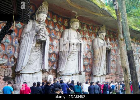 Chongqing. 12th Nov, 2020. Tourists visit the Dazu Rock Carvings at Dazu District of southwest China's Chongqing Municipality on Nov. 12, 2020. The scenic spot has seen an increasing number of tourists since its reopening in June, with some 2,000 a day. More than 50,000 individual rock carvings lie in the grottoes of Chongqing's Dazu District. The carvings date from the 9th to 13th centuries and entered on the World Heritage List by the United Nations Educational, Scientific and Cultural Organization in 1999. Credit: Liu Chan/Xinhua/Alamy Live News Stock Photo