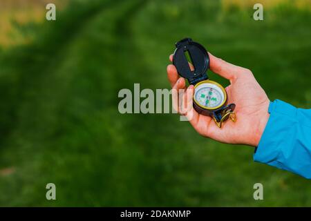 Hike Using Compass traveler using a compass during a hike, navigation close-up Stock Photo ...