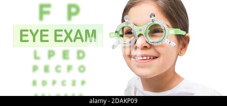 Child eye test and eye exam. Little girl having eye check-up, wearing special glasses. Vision diagnostic Stock Photo