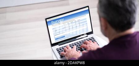 Online Survey Business Feedback Report Or Form On Computer Stock Photo