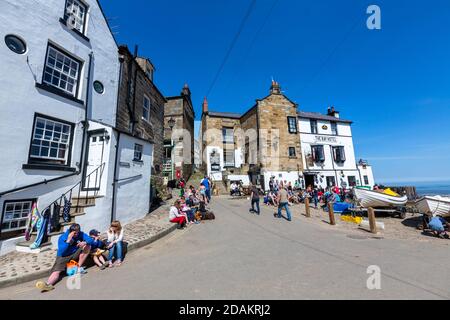 Tourists in Robin Hood's Bay,  small fishing village, North Yorkshire, England, UK Stock Photo