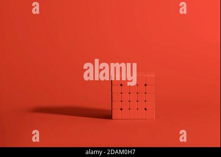Monochromatic, red, 5x5 Rubik's Cube on a Red Background, Magic Cube, Puzzle Cube Stock Photo