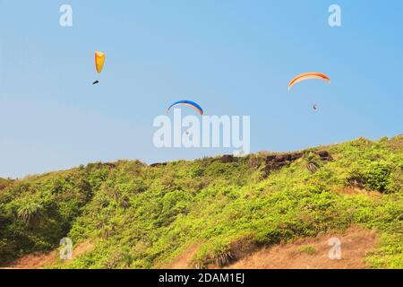 Paragliding over Arambol beach. North Goa, India Stock Photo