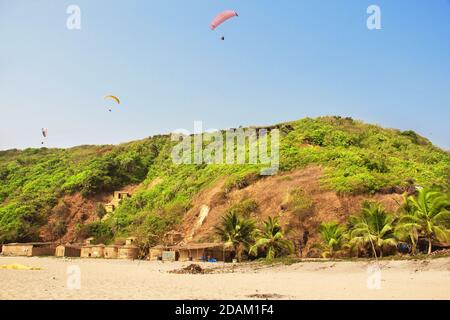 Paragliding over Arambol beach. North Goa, India Stock Photo