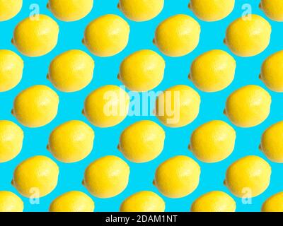 Seamless geometric pattern, lemon on a delicate turquoise background. Stock Photo