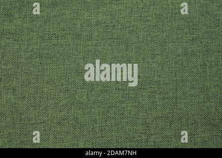 Green fabric, textile backgrounds. Coarse cotton linen surface. Abstract cloth pattern, thread weave. textile industry background. Fabric for furnitur Stock Photo