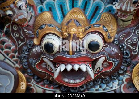 Wooden carving depicting Bhoma. In Balinese mythology, Bhoma is the son of Dewa Wisnu and Dewi Pertiwi, the god of rain and the goddess of earth Stock Photo