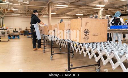 Chicago, Illinois, USA. 12th Nov, 2020. Chicago Food Depository volunteers work during Martin Luther King Day celebrations. Volunteers load food into Greater Chicago Food Depository boxes. Credit: Kenneth Johnson/ZUMA Wire/Alamy Live News Stock Photo