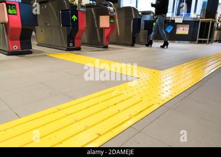 Indoor tactile paving foot path for blind and vision handicap Stock Photo