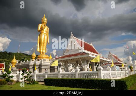 Golden Standing Buddha Peak at Hat Yai Municipality Park in Hat Yai, Songkhla Province in the south of Thailand. Stock Photo