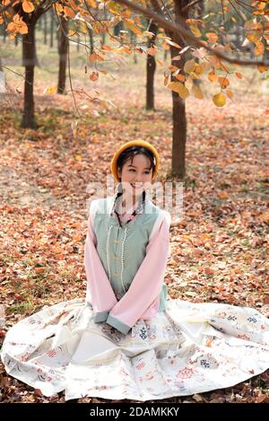 (201114) -- HEZE, Nov. 14, 2020 (Xinhua) -- Sun Yan, an online clothes store owner, presents the costume she designed in the fusion of the traditional clothing of the Han ethnic group that is generally called Hanfu, in Sunzhuang Village in Caoxian County of Heze City, east China's Shandong Province, Nov. 10, 2020. Sunzhuang Village thrives on e-commerce business. Among some 760 households in the village, more than 560 run online clothes stores on Taobao.com, Alibaba's main e-commerce site. The village's sales volume of costumes exceeded 200 million yuan (about 30.22 million U.S. dollars) in 20 Stock Photo