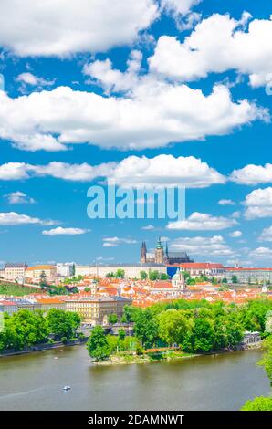 Aerial vertical view of Prague city, historical center with Prague Castle, St. Vitus Cathedral in Hradcany district, Strelecky island, Vltava river, blue sky white clouds, Bohemia, Czech Republic Stock Photo