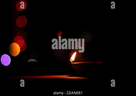 Traditional clay diya lamps lit during diwali celebration Stock Photo