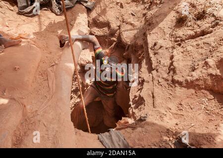 Selingue, Mali, 28th April 2015; Faraba gold mine.  People come from all over Mali to work here in the dry season. Conditions are tough with stale air Stock Photo