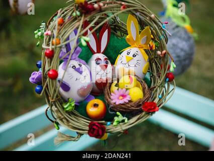 Folk art and festival of Easter Eggs. Easter holiday. Easter eggs in the form of rabbits in the nest Stock Photo