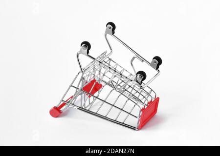 Empty inverted shopping cart on white background - Concept of shopping cart abandonment Stock Photo