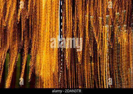 Speed of digital lights in motion. Bright orange neon glowing fast moving streams of light, along a trajectory. Fast energy flying wave line with flas Stock Photo