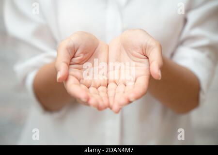 closeup female two hand open palm clean white cloth for giving helping asking image concept. Stock Photo