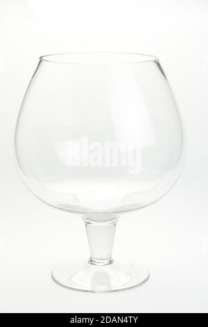 Vertical shot of a brandy glass on a white background Stock Photo