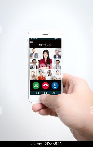 smartphone app using business video call or internet calling with group of face people meeting. Stock Photo