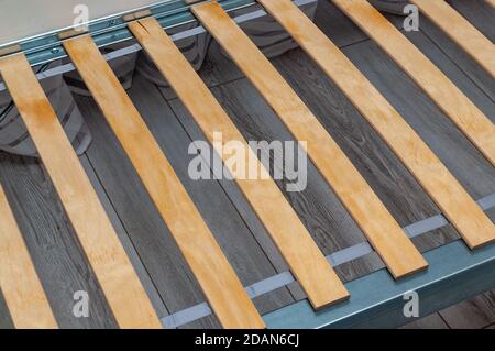 birch slats on the metal frame of the bed. High quality photo Stock Photo