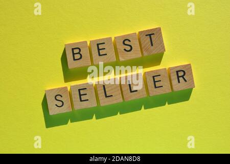 Best Seller, words in wood alphabet letters isolated on bright yellow background Stock Photo