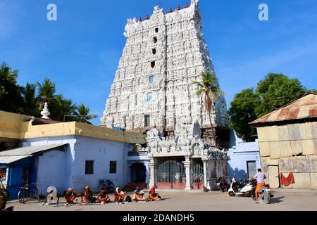 Temple in Tamil Nadu, India with sadhus or holy men requesting alms at entrance. Stock Photo