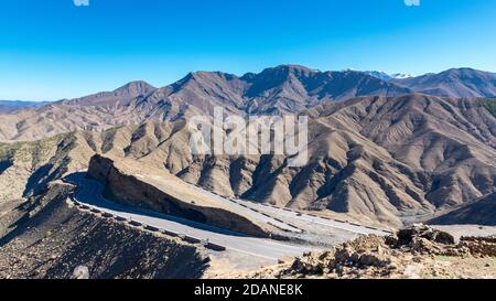 Curved road in Tizi n Tichka mountain pass in the Atlas Mountains. Road to the Sahara desert. Travel concept. High Atlas, Morocco Stock Photo