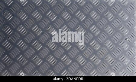 A stainless steel textured footplate with a regular pattern of ridges to create a safe non-slip surface. Stock Photo