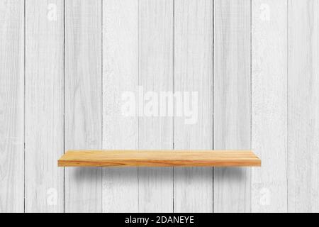Empty wood shelf on white wooden wall texture background. Stock Photo