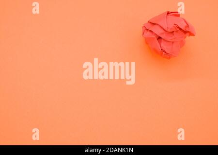 Closeup shot of orange colored paper on orange background Stock Photo
