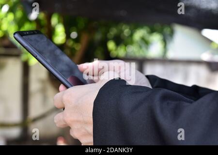 Close up of man using smartphone. selective focus Stock Photo