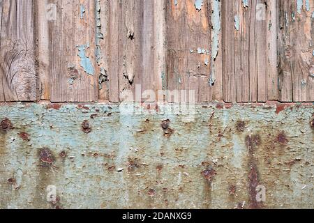 Cracked paint on wall of wood and rusty metal Stock Photo