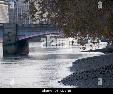 Views over the Thames from the Victoria Tower Gardens London  The thames foreshore with Vauxhall Bridge Stock Photo