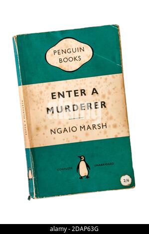 An old, battered & foxed green Penguin crime paperback copy of Enter a Murderer by Ngaio Marsh.  First published in 1935. Stock Photo