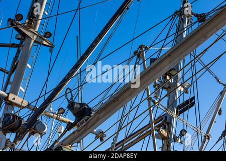 Abstract image of masts and winch cables on commercial fishing vessels in Steveston Harbour British Columbia Canada