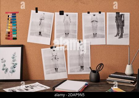Color palette and photos on carton board in front of table with other supplies Stock Photo