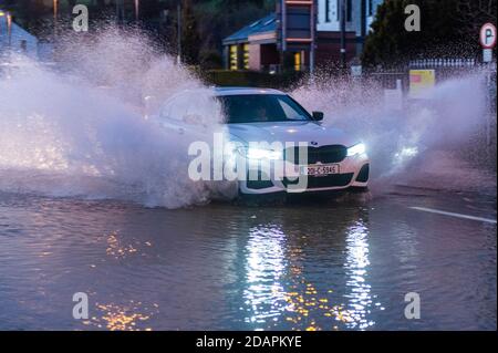 Bantry, West Cork, Ireland. 14th Nov, 2020. Bantry town flooded yet again this evening after a day of rain. The road in the town square was flooded due to the amount of rain, which caused the tarmac to lift. Credit: AG News/Alamy Live News Stock Photo